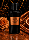 Bottle of Bare Sugar body wash with a decorative background featuring a rose and draped fabric.