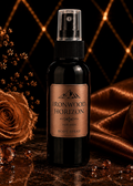 Bottle of Ironwood Horizon Body Spray with a rose and draped fabric on a dark background