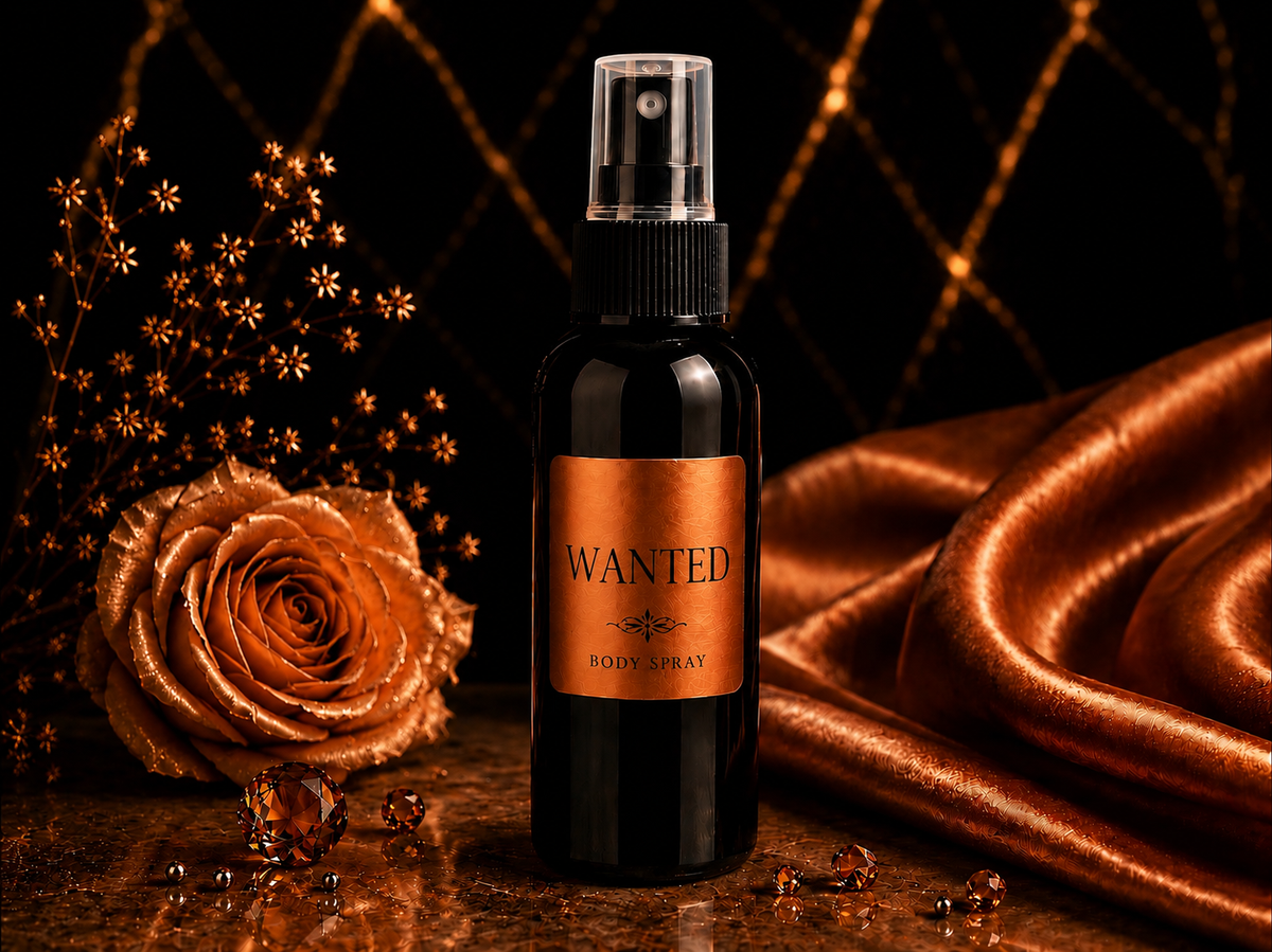 Body spray bottle labeled 'WANTED' with decorative elements on a dark background